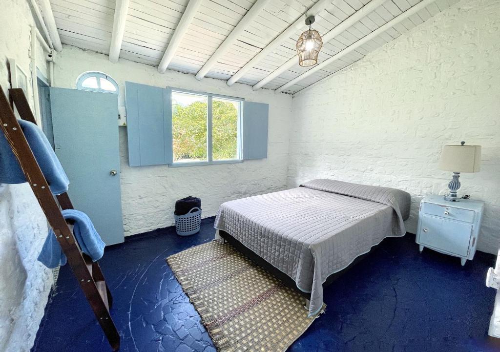 Postel nebo postele na pokoji v ubytování Hermosa Casa frente al Río