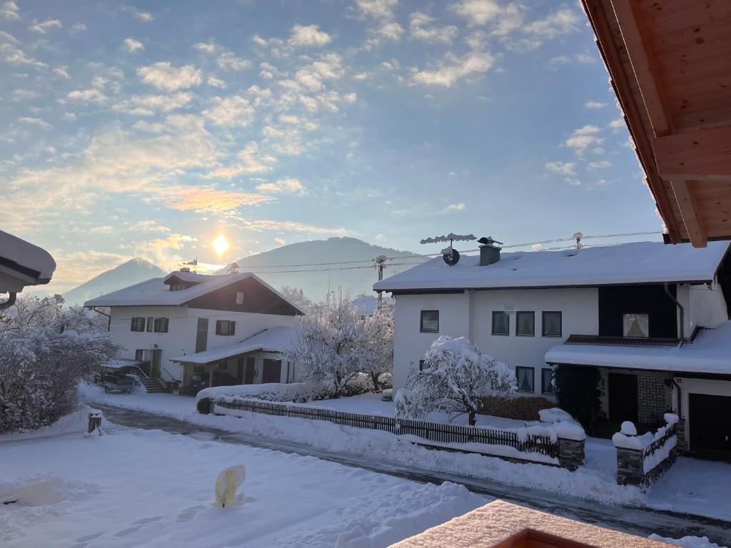 a view of some buildings in the snow at Ferienwohnung Osterbach in Bad Feilnbach