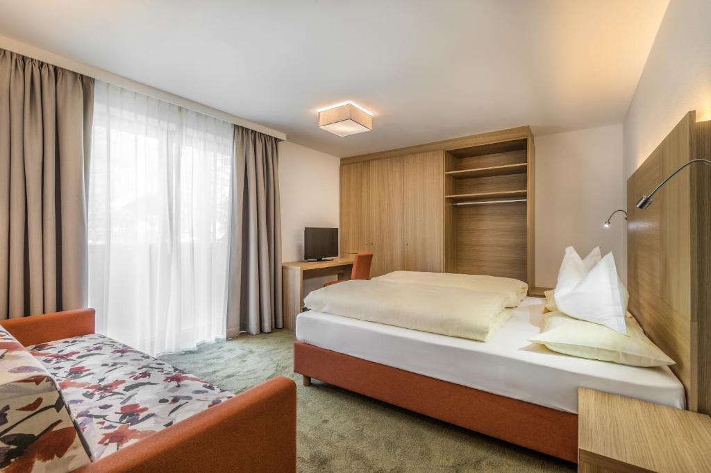 Letto o letti in una camera di Hotel Miramonti