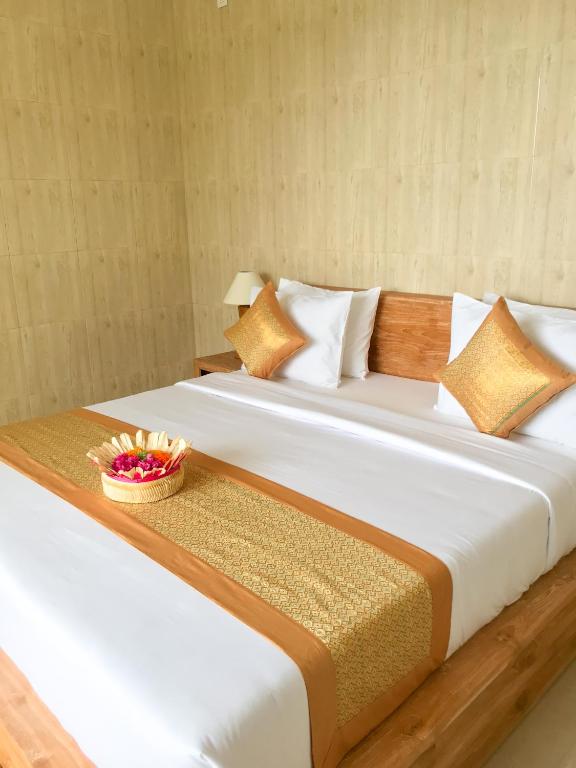 Postel nebo postele na pokoji v ubytování Heri house ubud