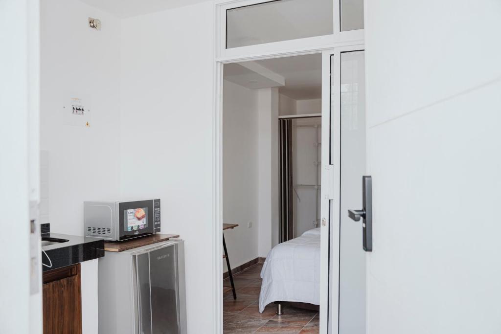 a room with a door leading to a bedroom at Comfort in Valledupar
