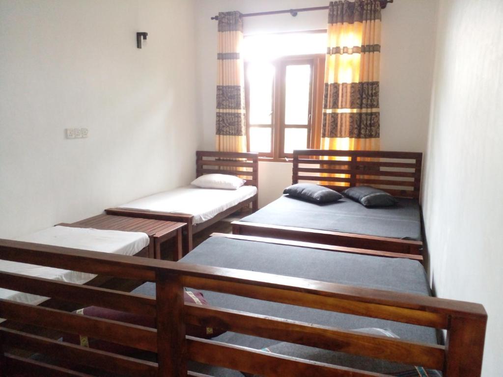 Postel nebo postele na pokoji v ubytování Kumudu Holiday Home