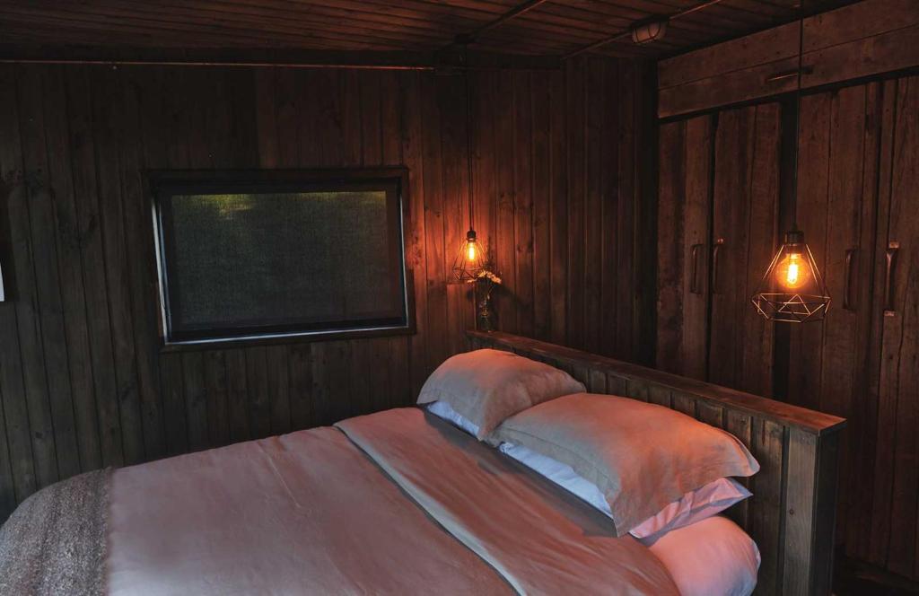 Postel nebo postele na pokoji v ubytování MA PU LODGE Futaleufu