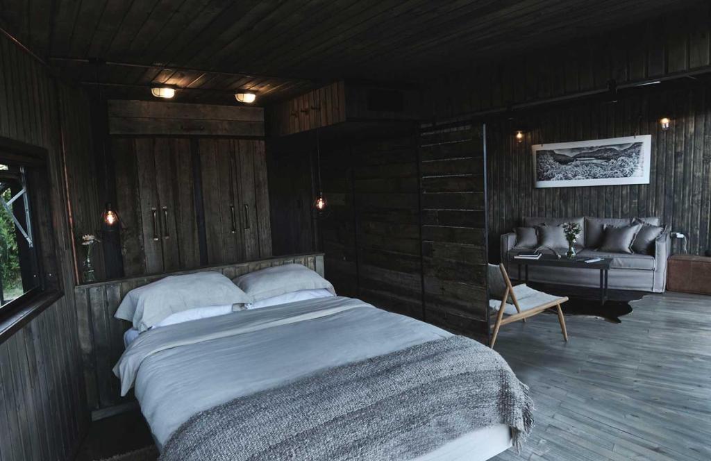 Postel nebo postele na pokoji v ubytování MA PU LODGE Futaleufu