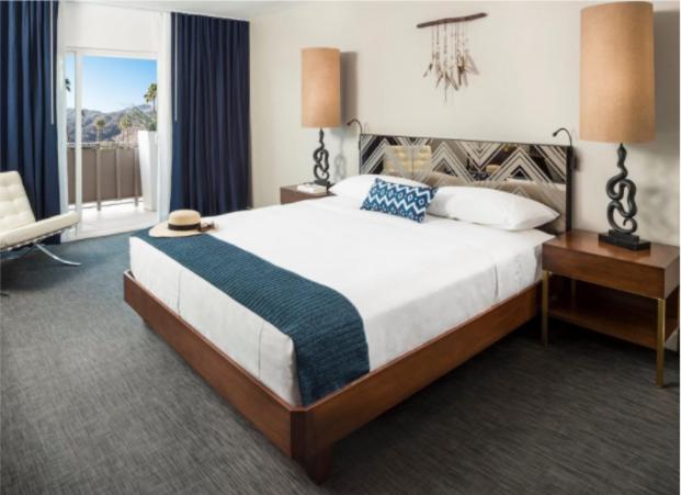Postel nebo postele na pokoji v ubytování V Palm Springs
