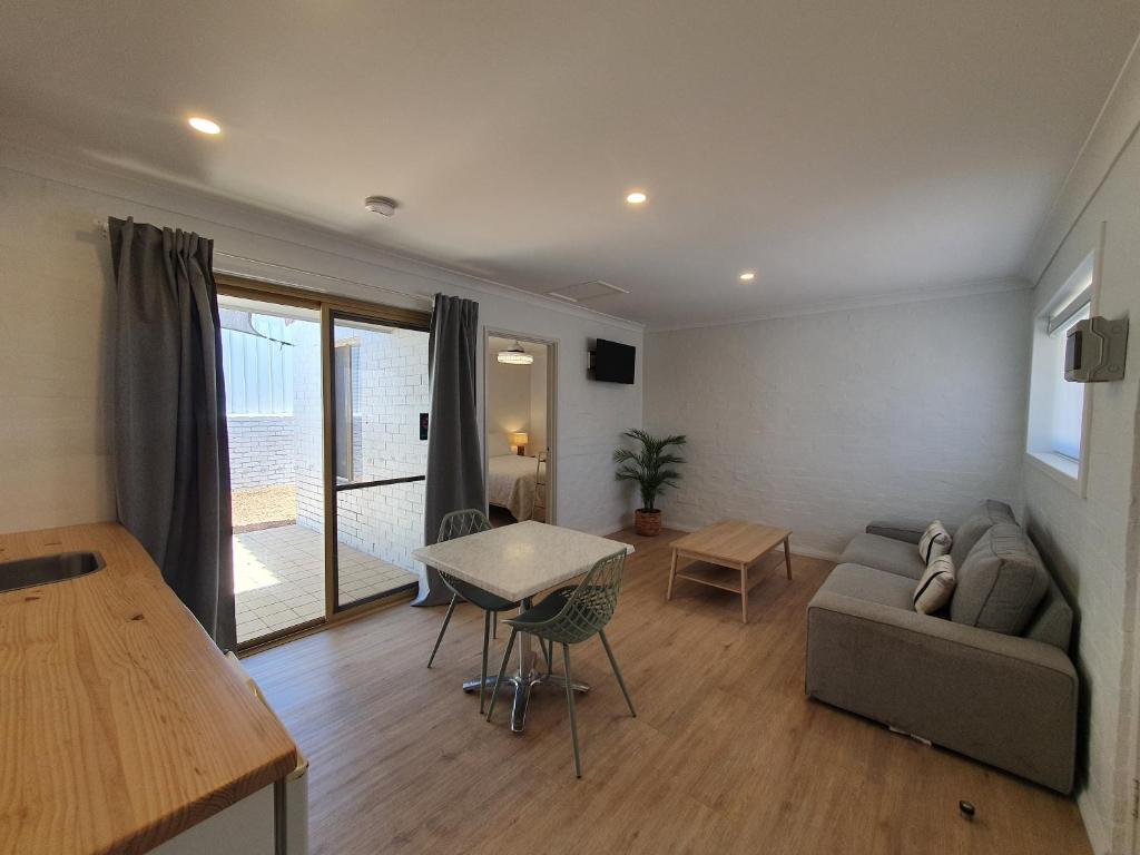 a living room with a couch and a table at The African Reef in Geraldton