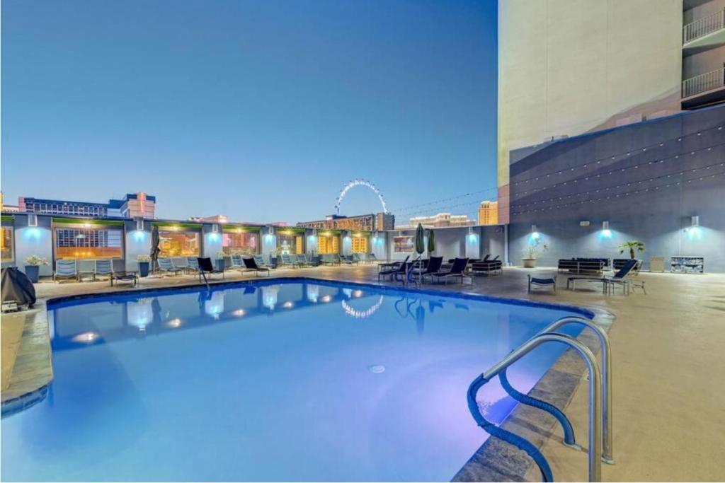 a large swimming pool in a large building at Princess Suite Platinum Hotel in Las Vegas