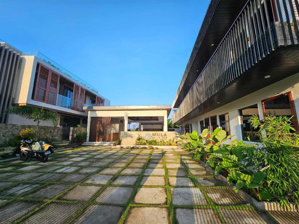 a courtyard of a building with plants in front of it at Mula De La Paz in Zambales