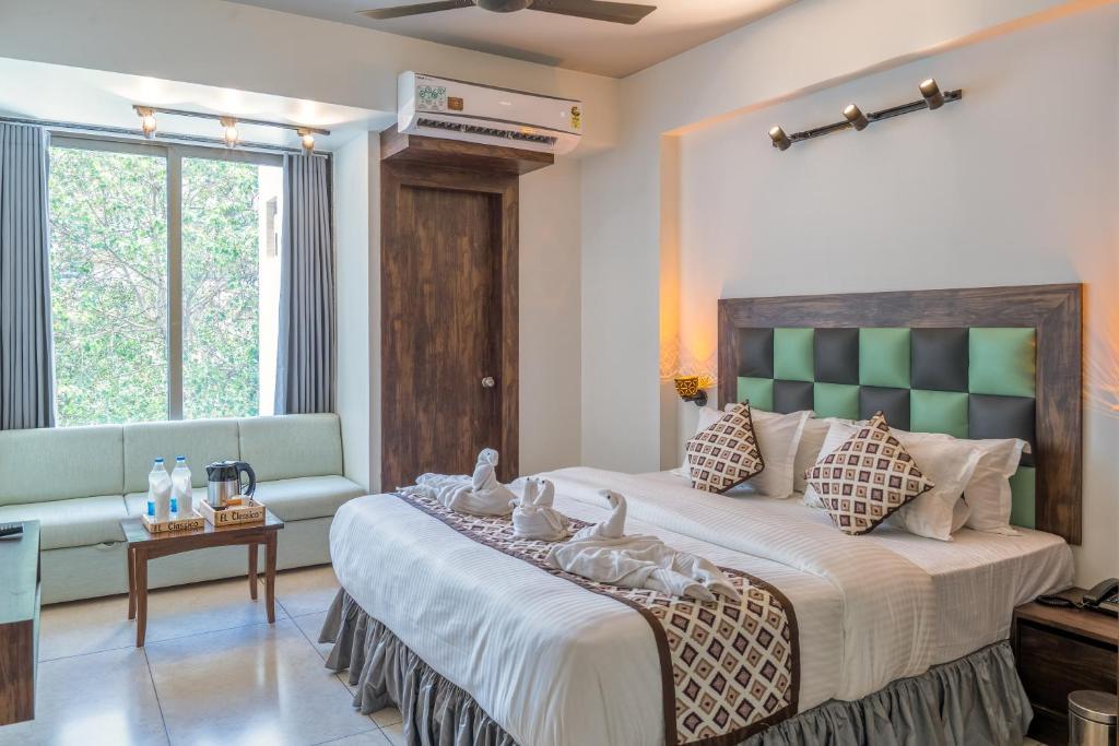 Un pat sau paturi într-o cameră la HOTEL EL CLASSICO