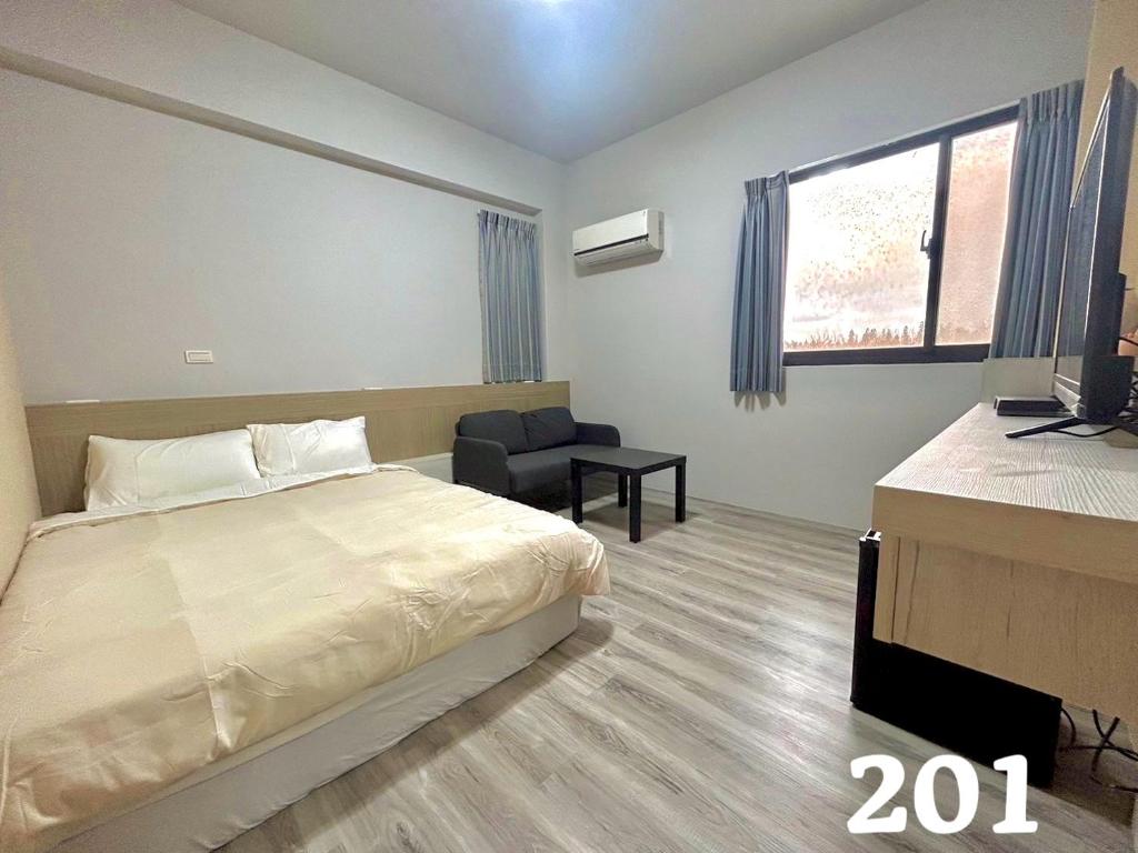 Postel nebo postele na pokoji v ubytování Anco Homestay