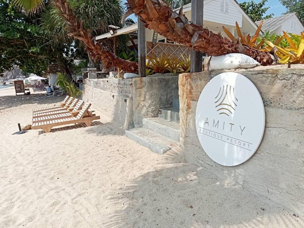 a sign for aninity resort on the beach at Amity Beach Resort in Koh Samui 
