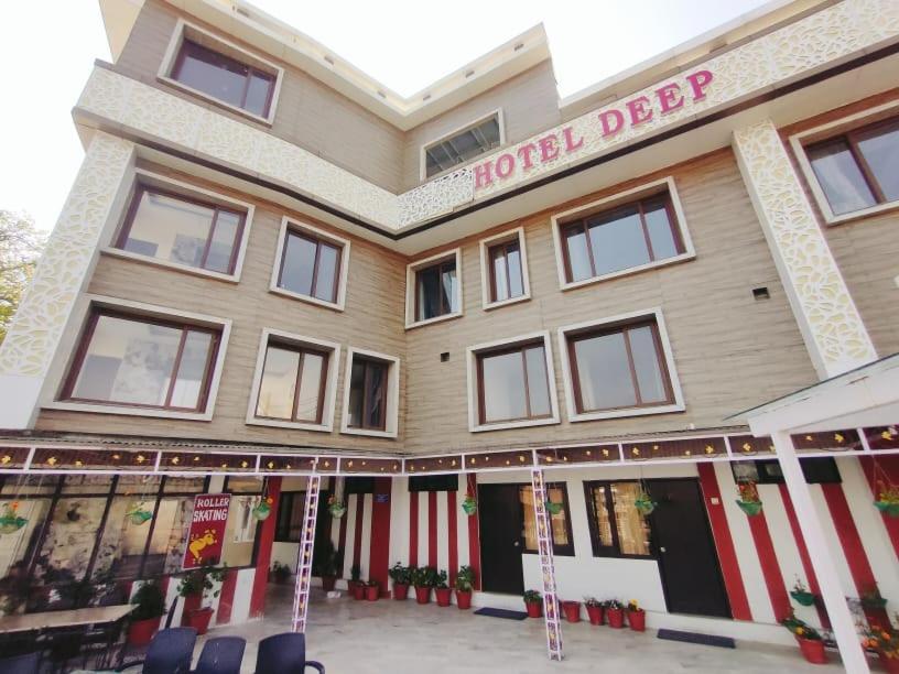 a hotel depot with chairs in front of it at Deep Hotel in Mussoorie