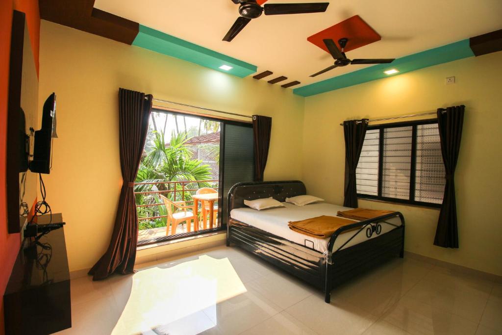 Säng eller sängar i ett rum på Redstone Resort-Nagaon-Alibaug