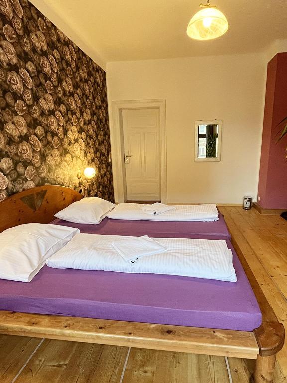 Postel nebo postele na pokoji v ubytování Homeplanet Hostel