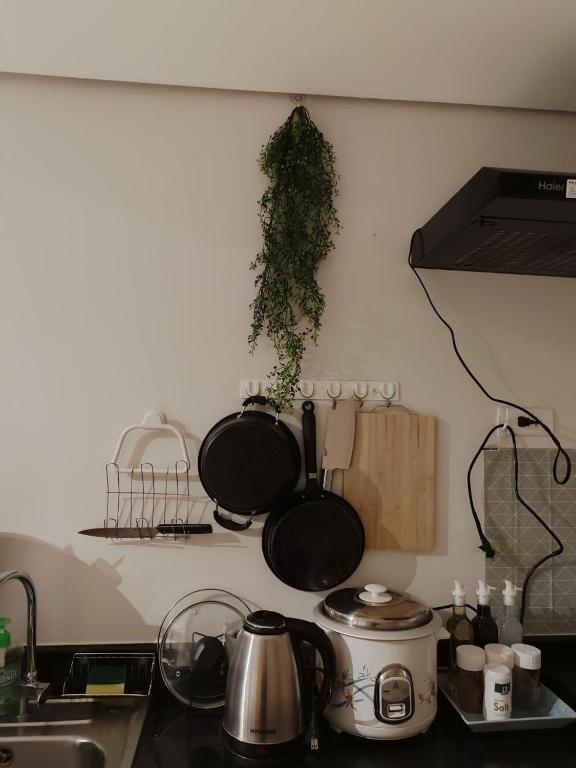 Kuchyň nebo kuchyňský kout v ubytování SMDC Grass Residences