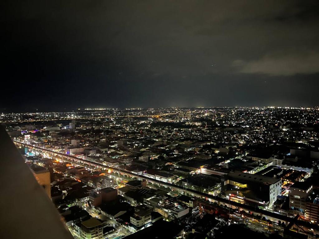 a view of a city at night with lights at SERENDIPITY PLACE @CELANDINE in Manila
