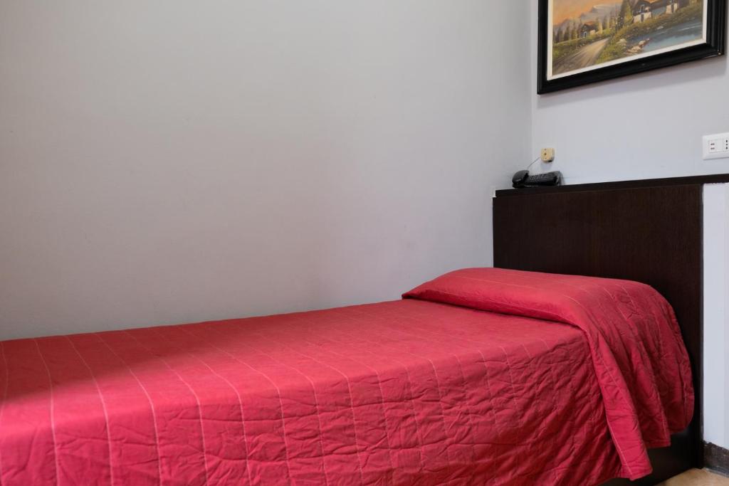 Hotel d'Este tesisinde bir odada yatak veya yataklar