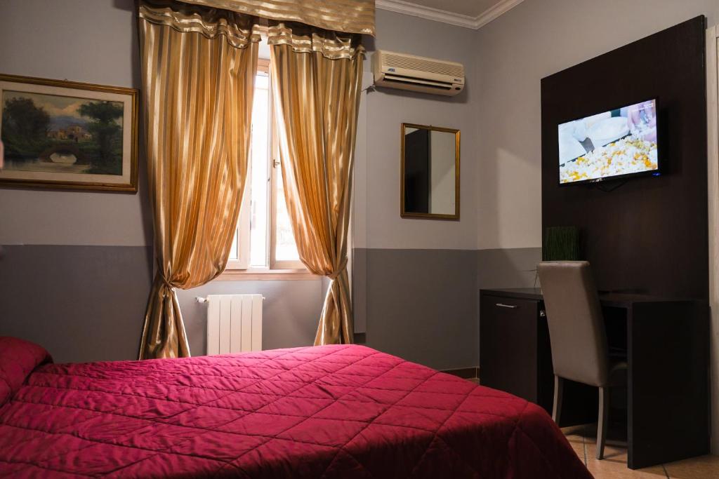 Hotel d'Este tesisinde bir odada yatak veya yataklar