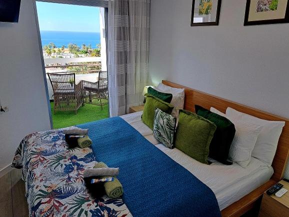 Postel nebo postele na pokoji v ubytování Ocean View Penthouse