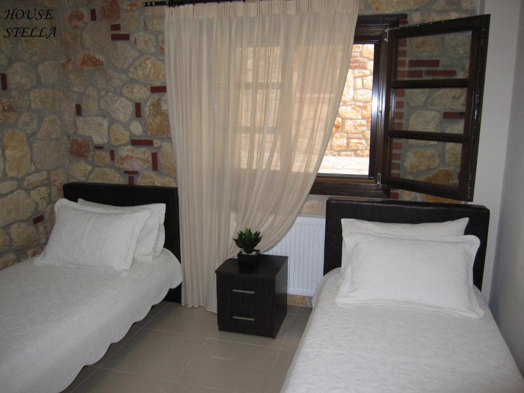 Postel nebo postele na pokoji v ubytování Psakoudia Villas