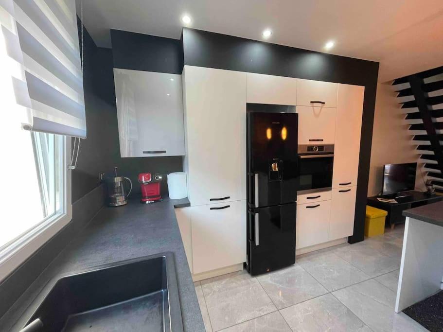 Kuchyň nebo kuchyňský kout v ubytování Duplex cosy Nancy à 10 minutes