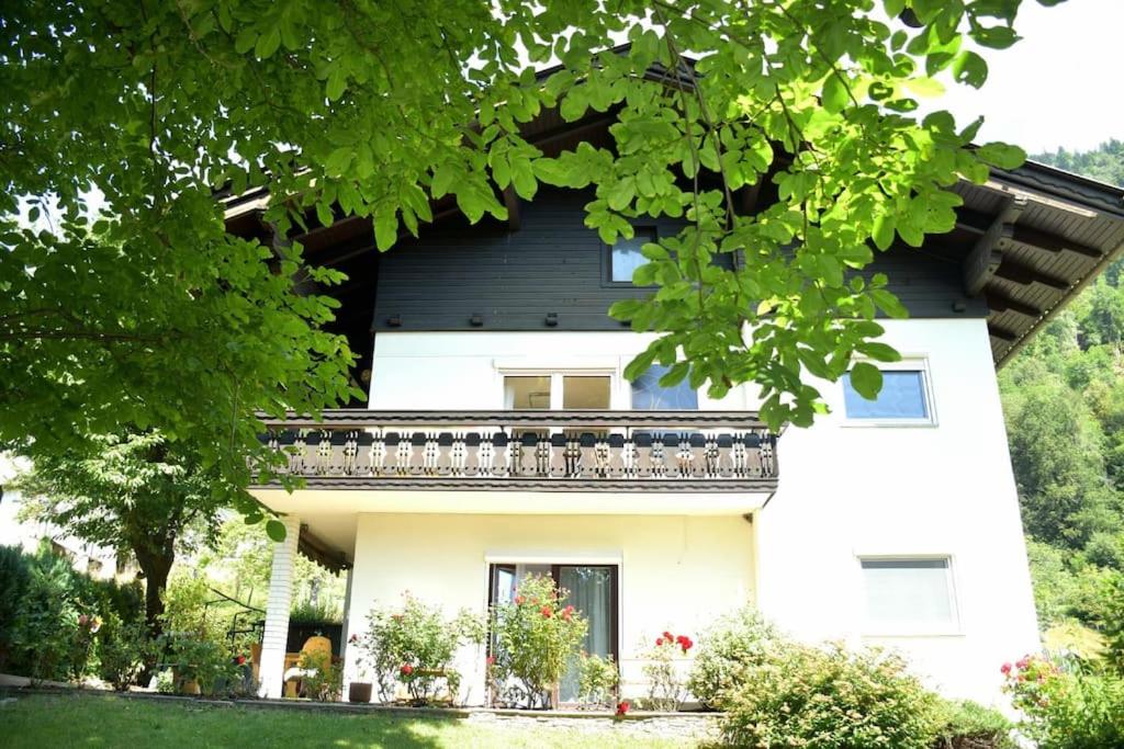 a house with a balcony on the side of it at Ferienhaus Julia - Ossiacher See in Sattendorf