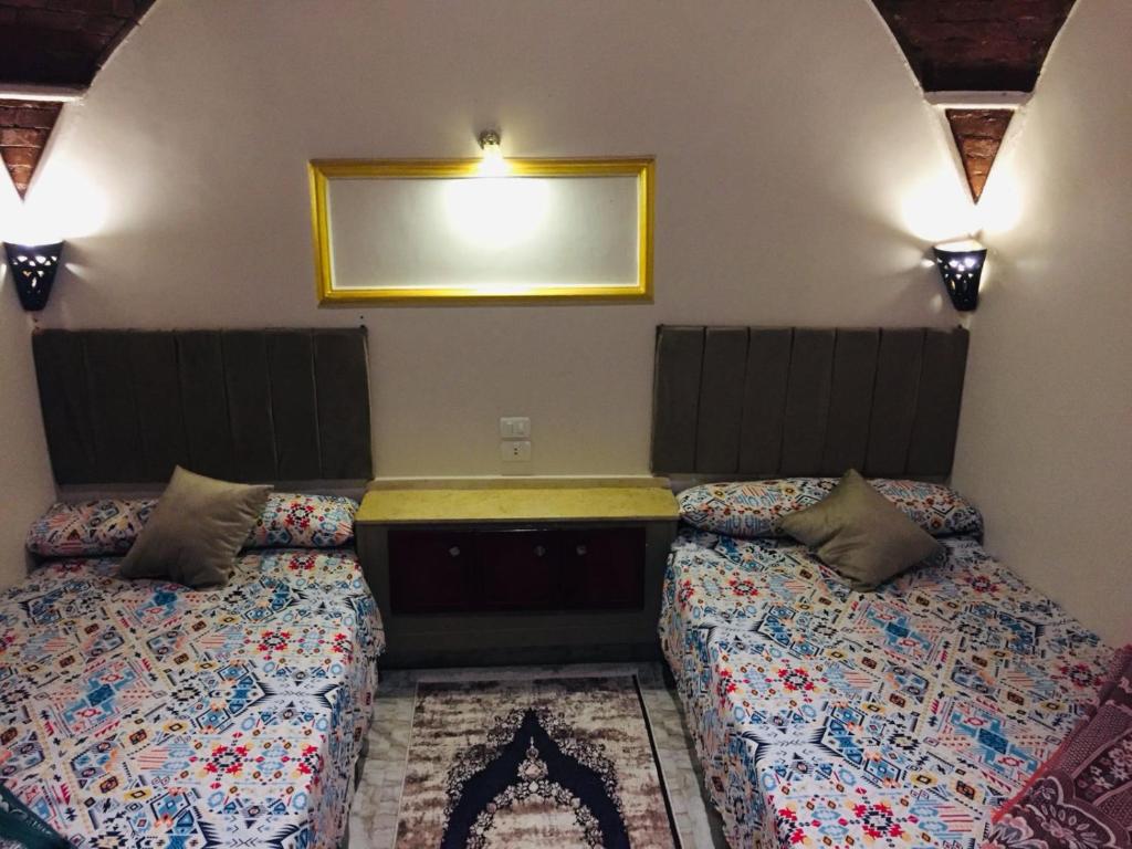 Кровать или кровати в номере Wessam House
