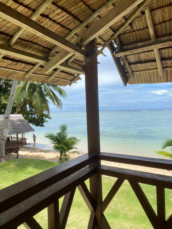 a view of the beach from a resort balcony at Ocam Ocam Casadyan Inn in New Busuanga