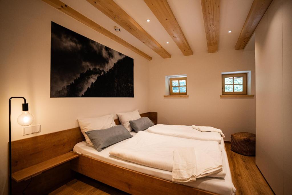 a bedroom with a large bed in a room at Hochwertige Ferienwohnung Hochsitz in Saulgrub