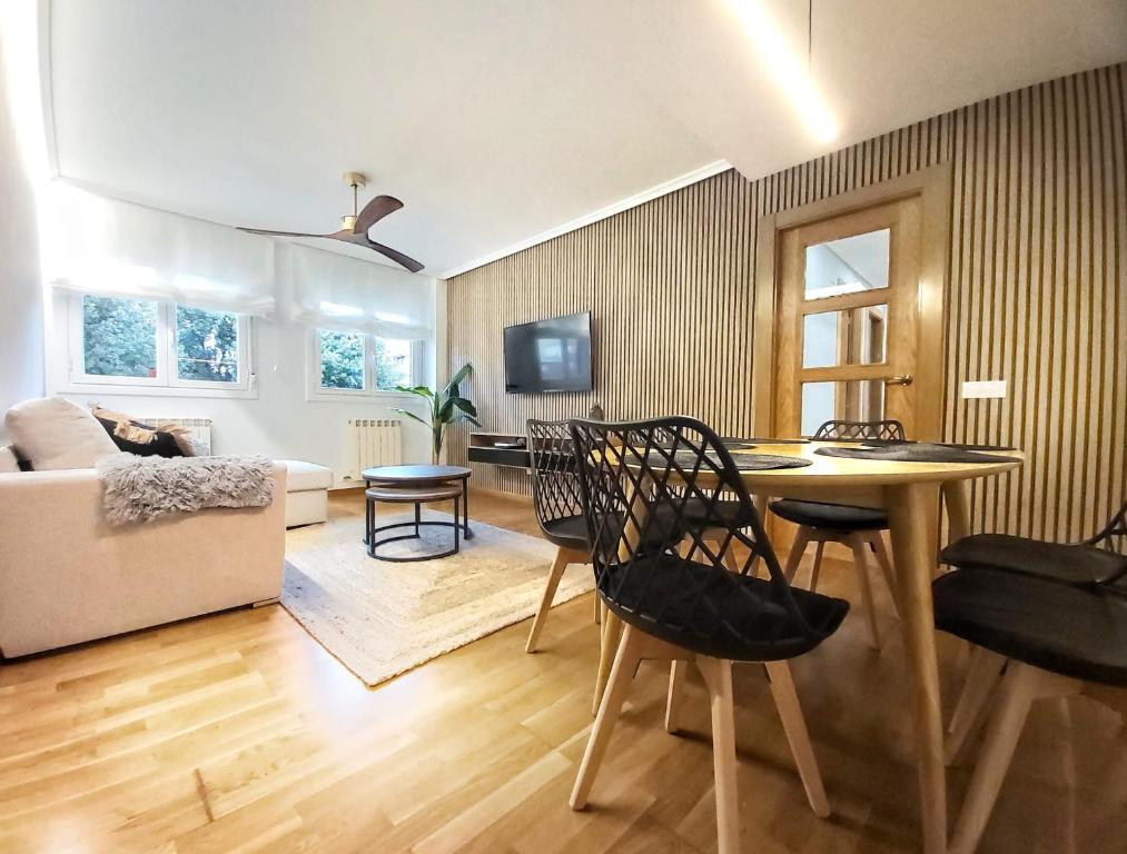 a living room with a table and chairs and a couch at Sleeping & Living Haro in Haro