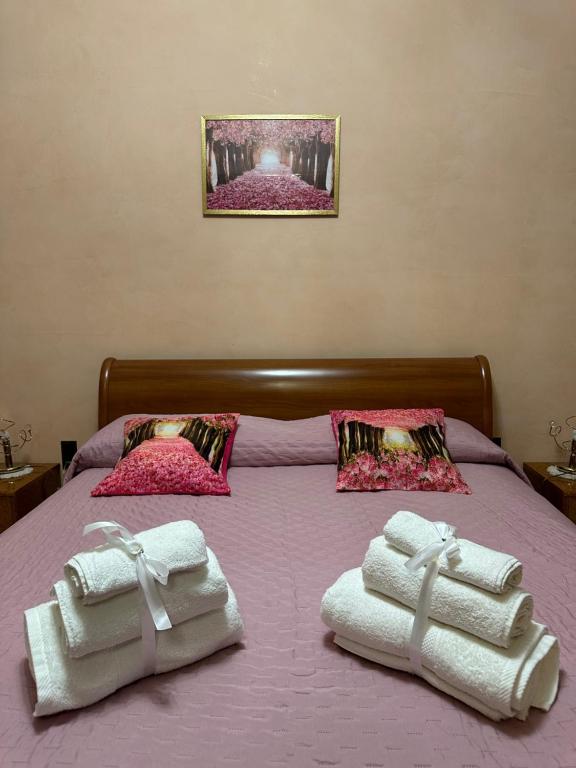 En eller flere senge i et værelse på La casa di Maria e Lello