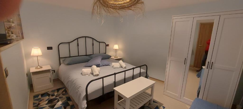 a bedroom with a bed with two pillows on it at CASA JO in Bari