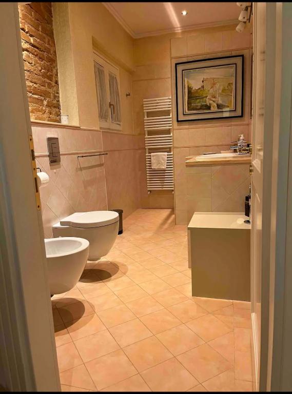 a bathroom with two toilets and a sink at Lusso e Charme! in Florence