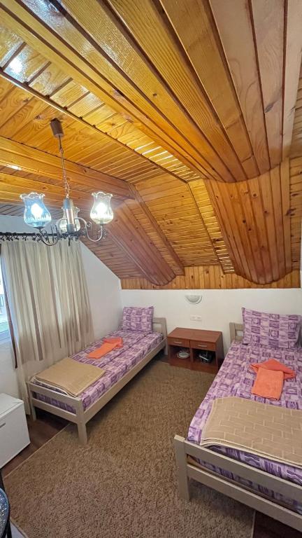 Postel nebo postele na pokoji v ubytování SNAM Rooms&Apartment