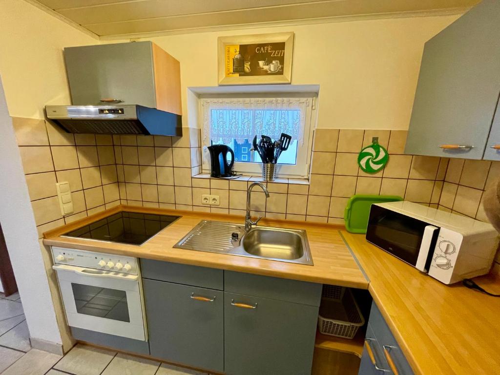 Kuchyň nebo kuchyňský kout v ubytování Ferienwohnung Tina