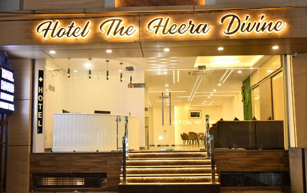 a store front with a sign that reads indide the elena drive at Hotel The Heera Divine in Kānpur