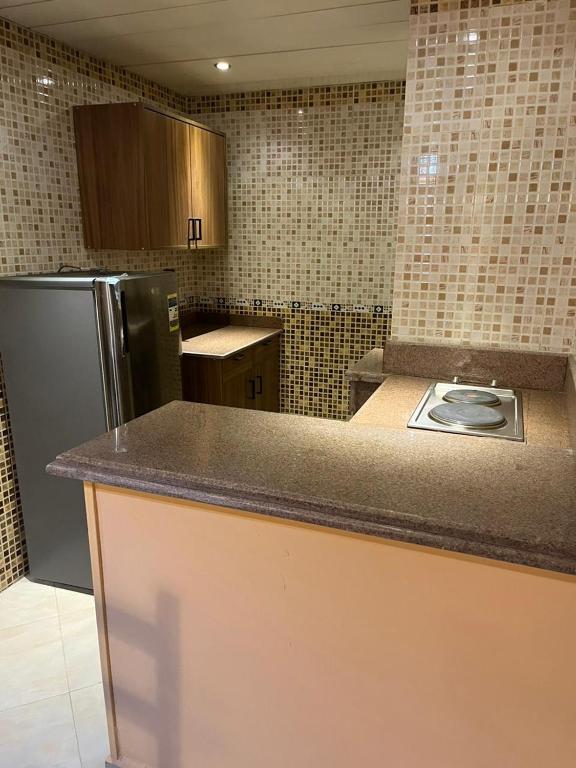 A kitchen or kitchenette at Heliopolis Rock Residence