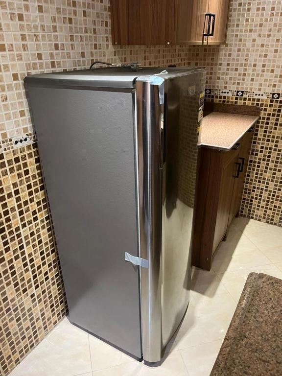 A kitchen or kitchenette at Heliopolis Rock Residence