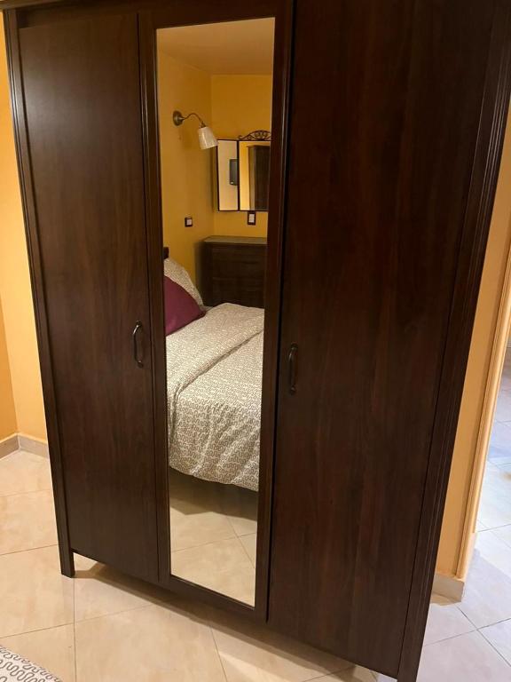 A bed or beds in a room at Heliopolis Rock Residence