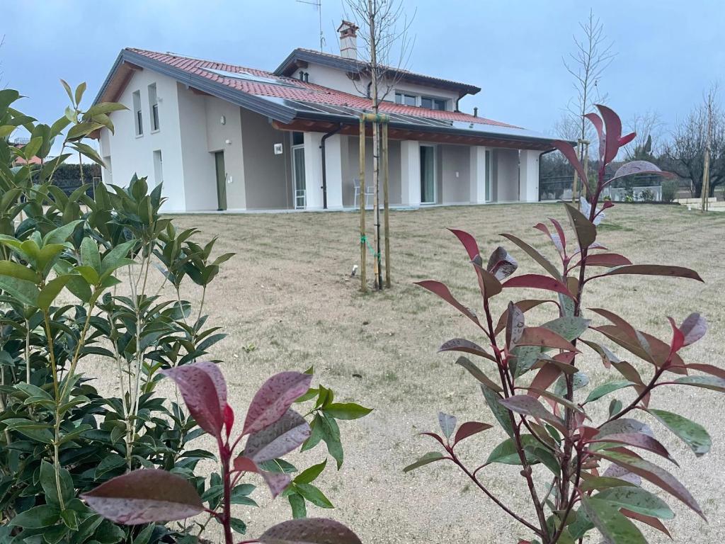 a house on a hill with plants in front of it at Il Fiore del lago in Pacengo di Lazise