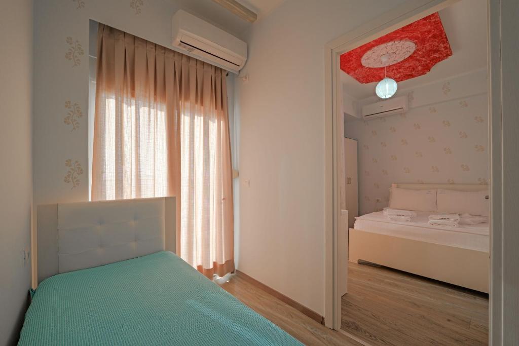 Voodi või voodid majutusasutuse Hotel Angjelo toas