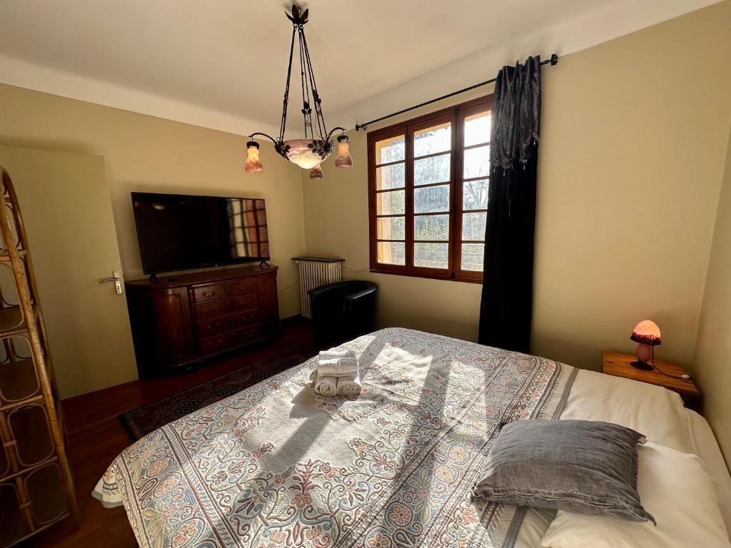Ένα ή περισσότερα κρεβάτια σε δωμάτιο στο Maison Vaquier 1