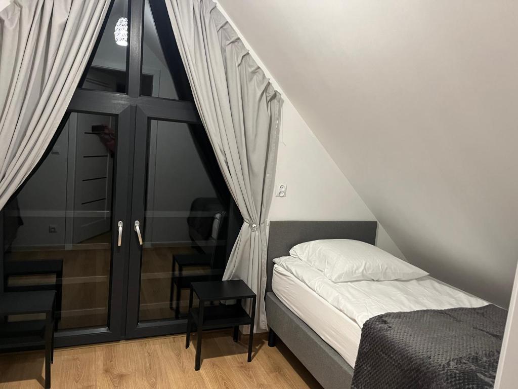 Postel nebo postele na pokoji v ubytování Domki nad morzem " Przy Lesie"