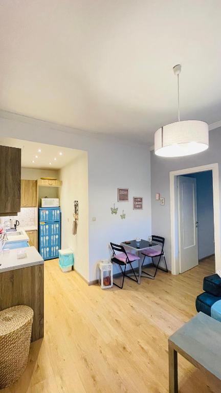 A seating area at Cozy apartment ideally located city center and Megaron Moussikis metro station