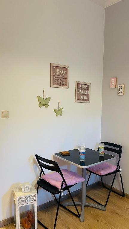 A seating area at Cozy apartment ideally located city center and Megaron Moussikis metro station