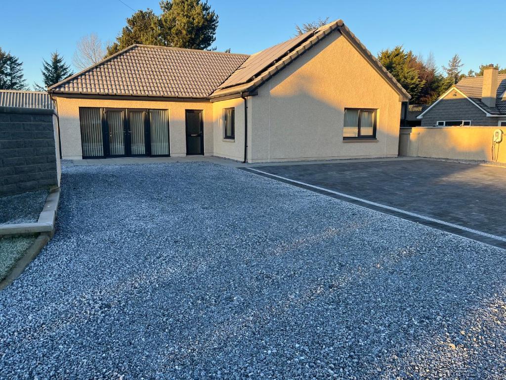 a house with a driveway in front of it at Beldorny in Kingston