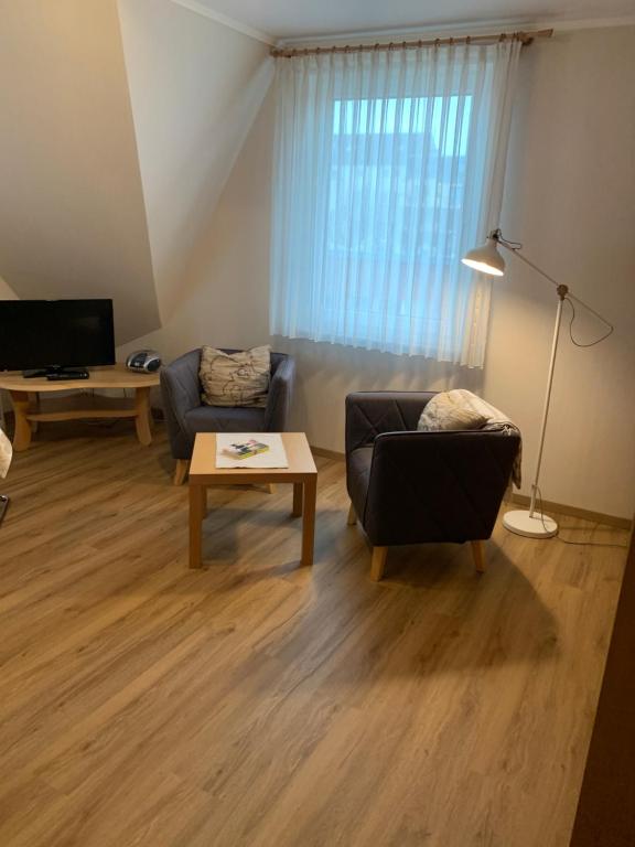 TV a/nebo společenská místnost v ubytování Pension Haus Beckmann