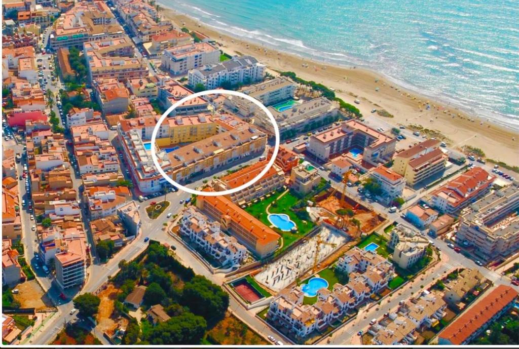 an aerial view of a city with a white circle at Apartamento en el Edificio Barlovento, situado en el centro de Alcossebre, a 150m del mar in Alcossebre