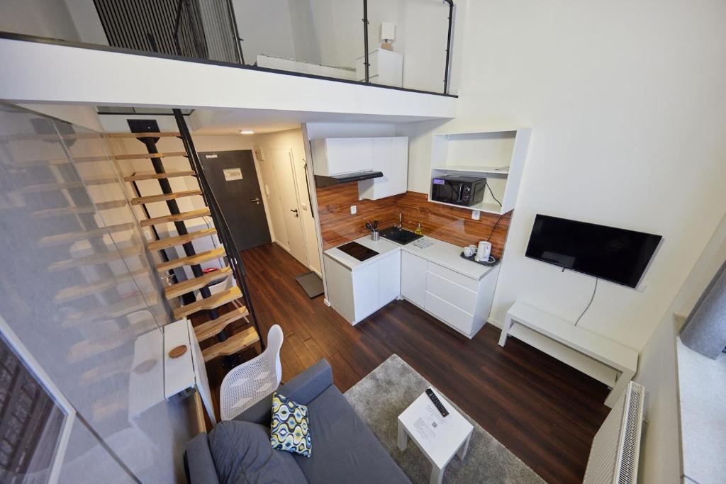 TV a/nebo společenská místnost v ubytování Block 96 Apartments