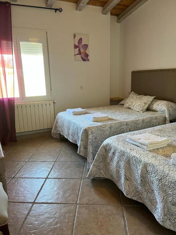 Postel nebo postele na pokoji v ubytování CORTIJO EL PRADO ll